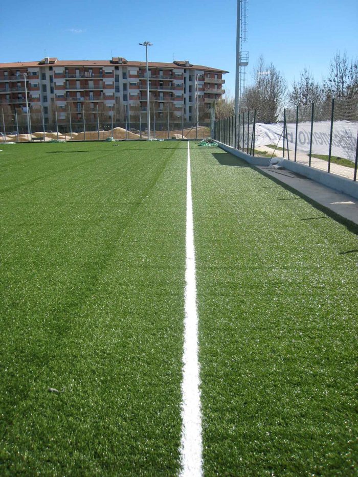 Concrete drainage channel for synthetic turf soccer fields